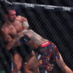 Charles Oliveira (red gloves) fights Michael Chandler (blue gloves) in the lightweight bout during UFC 309 at Madison Square Garden.