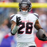Oct 13, 2024; Foxborough, Massachusetts, USA; Houston Texans running back Joe Mixon (28) runs with the ball against the New England Patriots during the first half at Gillette Stadium. Mandatory Credit: Gregory Fisher-Imagn Images
