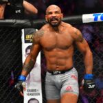 Israel Adesanya (red gloves) fights Yoel Romero (blue gloves) during UFC 248 at T-Mobile Arena.