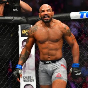 Israel Adesanya (red gloves) fights Yoel Romero (blue gloves) during UFC 248 at T-Mobile Arena.
