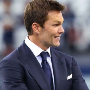 Fox Sports commentator Tom Brady on the field before the game between the Dallas Cowboys and New Orleans Saints at AT&T Stadium.
