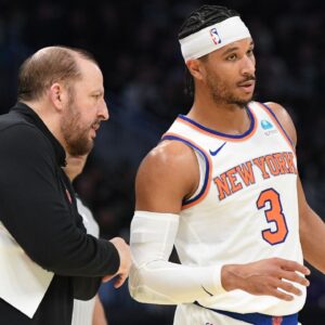 New York Knicks coach Tom Thibodeau talks with New York Knicks guard Josh Hart (3) on the sideline against the Milwaukee Bucks in the first half at Fiserv Forum.
