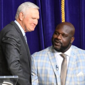 Jerry West (left) shakes hands with Los Angeles Lakers former center Shaquille O'Neal during ceremony to unveil statue of O'Neal at Staples Center.