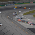 NASCAR Cup Series drivers break for pit road at the end of the first stage during the Quaker State 400 at Kentucky Speedway.