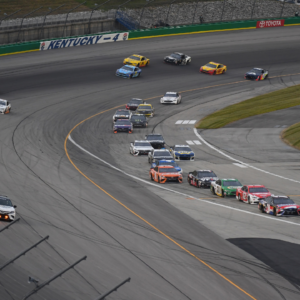 NASCAR Cup Series drivers break for pit road at the end of the first stage during the Quaker State 400 at Kentucky Speedway.