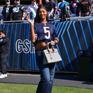 Chicago Sky forward Angel Reese poses for a photo before the game between the Chicago Bears and Carolina Panthers at Soldier Field.