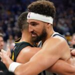 Mavericks guard Klay Thompson (31) hugs Golden State Warriors guard Stephen Curry (30) after a game at the Chase Center.