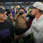 Baltimore Ravens coach John Harbaugh (left) shakes hands with brother and Los Angeles Chargers coach Jim Harbaugh after the game at SoFi Stadium.