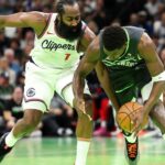 Minnesota Timberwolves guard Anthony Edwards (5) and LA Clippers guard James Harden (1) compete for the ball during the second half of an NBA Cup game at Target Center.