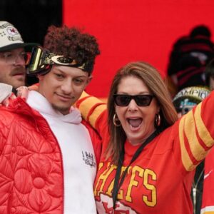 Kansas City Chiefs quarterback Patrick Mahomes (15) celebrates with his mother Randi Martin during the Kansas City Chiefs Super Bowl parade.