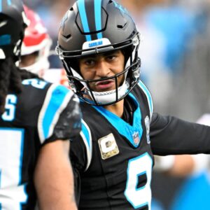 Nov 24, 2024; Charlotte, North Carolina, USA; Carolina Panthers quarterback Bryce Young (9) talks to running back Jonathon Brooks (24) in the fourth quarter at Bank of America Stadium.