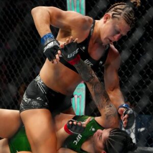 Ketlen Vieira (red gloves) fights Kayla Harrison (blue gloves) during UFC 307 at Delta Center.