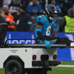 Carolina Panthers running back Miles Sanders (6) leaves the field with an injury against the New York Giants in the first half during the 2024 NFL Munich Game at Allianz Arena.