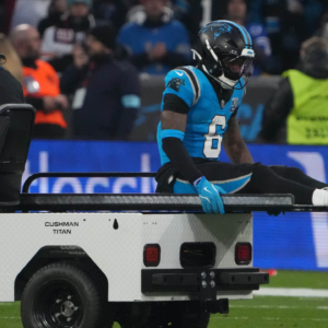 Carolina Panthers running back Miles Sanders (6) leaves the field with an injury against the New York Giants in the first half during the 2024 NFL Munich Game at Allianz Arena.