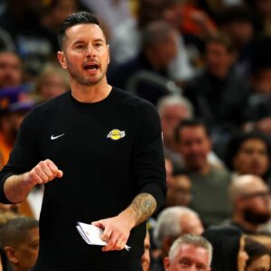 Los Angeles Lakers head coach JJ Redick talks to his team during the half of the game against the Phoenix Suns at Footprint Center.