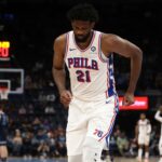 Philadelphia 76ers center Joel Embiid (21) limps to the bench during a time out during the second half against the Memphis Grizzlies at FedExForum