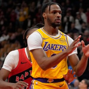 Los Angeles Lakers guard Bronny James (9) looks for a pass as Toronto Raptors guard Ja'Kobe Walter (14) defends during the second half at Scotiabank Arena.