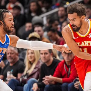 Atlanta Hawks guard Trae Young (11) is defended by New York Knicks guard Jalen Brunson (11) during the first half at State Farm Arena.