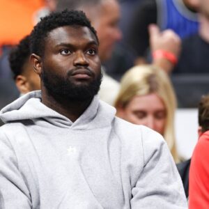 New Orleans Pelicans forward Zion Williamson (1) looks on from the bench against the Orlando Magic in the third quarter at Kia Center.