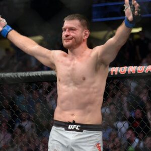 Stipe Miocic celebrates his championship victory by TKO against Daniel Cormier during UFC 241 at Honda Center.