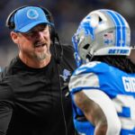Detroit Lions head coach Dan Campbell shakes hands with running back Jahmyr Gibbs (26) after Sam LaPorta's touchdown against Tennessee Titans during the first half at Ford Field in Detroit on Sunday, Oct. 27, 2024.