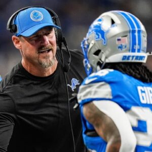 Detroit Lions head coach Dan Campbell shakes hands with running back Jahmyr Gibbs (26) after Sam LaPorta's touchdown against Tennessee Titans during the first half at Ford Field in Detroit on Sunday, Oct. 27, 2024.