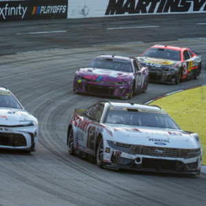NASCAR Cup Series driver Denny Hamlin (11) and driver Ryan Blaney (12) out of turn two during the Xfinity 500 at Martinsville Speedway.