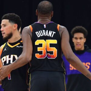 Phoenix Suns guard Devin Booker (1) and forward Kevin Durant (35) react against the Los Angeles Clippers during the second half at Intuit Dome.