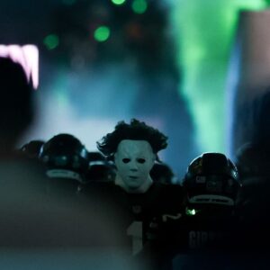 New York Jets cornerback Sauce Gardner (1) runs onto the field in a Michael Myers mask before the first half of their game against the Houston Texans at MetLife Stadium.