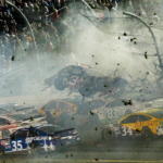 NASCAR Sprint Cup Series driver Austin Dillon car (3) crashes against the catch fence during the finish of the Coke Zero 400 at Daytona International Speedway.