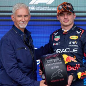 F1 Grand Prix of Hungary - Qualifying Max Verstappen of the Netherlands and Oracle Red Bull Racing receives the poleman award from Damon Hill in the parc ferme after the qualifying ahead of the F1 Grand Prix of Belgium at Circuit de Spa-Francorchamps