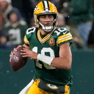 Nov 28, 2024; Green Bay, Wisconsin, USA; Green Bay Packers quarterback Jordan Love (10) looks to throw a pass during the first quarter against the Miami Dolphins at Lambeau Field.