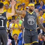 Golden State Warriors center DeMarcus Cousins (0) celebrates with Golden State Warriors guard Klay Thompson (11) during the first quarter against the Toronto Raptors in game six of the 2019 NBA Finals at Oracle Arena.