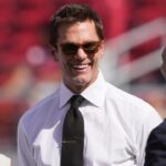 Oct 6, 2024; Santa Clara, California, USA; Fox color commentator Tom Brady (center) talks with San Francisco 49ers CEO Jed York (left) and general manager John Lynch (right) before the game against the Arizona Cardinals at Levi's Stadium.