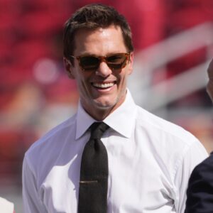 Oct 6, 2024; Santa Clara, California, USA; Fox color commentator Tom Brady (center) talks with San Francisco 49ers CEO Jed York (left) and general manager John Lynch (right) before the game against the Arizona Cardinals at Levi's Stadium.