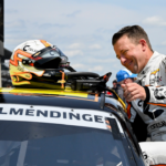 NASCAR Xfinity Series driver AJ Allmendinger climbs into his car during qualifying for the Pennzoil 250, Saturday, July 20, 2024, at Indianapolis Motor Speedway.