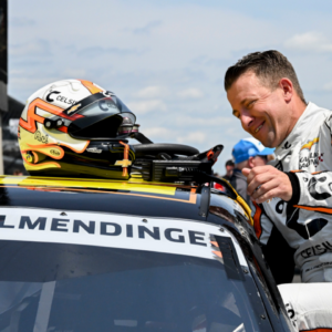 NASCAR Xfinity Series driver AJ Allmendinger climbs into his car during qualifying for the Pennzoil 250, Saturday, July 20, 2024, at Indianapolis Motor Speedway.