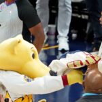 Denver Nuggets mascot Rocky shoves a signed jersey into the face of NBA former player Charles Barkley during halftime in game two of the 2023 NBA Finals between the Miami Heat and Denver Nuggets at Ball Arena.