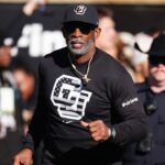 Colorado Buffaloes head coach Deion Sanders looks on before the game against the Utah Utes at Folsom Field.