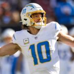 Nov 3, 2024; Cleveland, Ohio, USA; Los Angeles Chargers quarterback Justin Herbert (10) throws the ball against the Cleveland Browns during the second quarter at Huntington Bank Field.