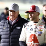 NASCAR Cup Series driver William Byron (24) and Rick Hendrick (left) walk on pit row during qualifying for the Daytona 500 at Daytona International Speedway.