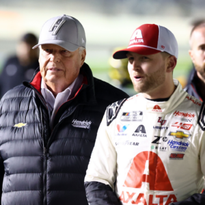 NASCAR Cup Series driver William Byron (24) and Rick Hendrick (left) walk on pit row during qualifying for the Daytona 500 at Daytona International Speedway.
