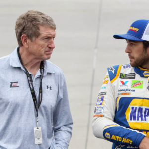 NASCAR Cup Series driver Chase Elliott (right) stands with his father and former driver Bill Elliott (left) prior to the AAA Drive for Autism at Dover International Speedway.