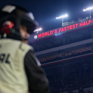 A NASCAR official watches during the Bass Pro Shops Night Race at Bristol Motor Speedway.
