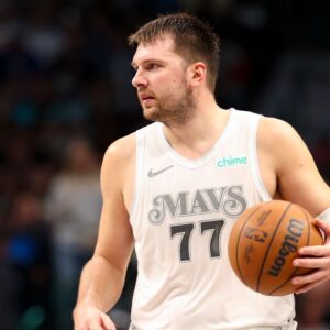 Dallas Mavericks guard Luka Doncic (77) controls the ball during the second half against the San Antonio Spurs at American Airlines Center