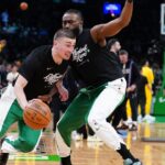 Boston Celtics guard Payton Pritchard (11) and Boston Celtics guard Jaylen Brown (7) practice before the game for game two of the eastern conference finals for the 2024 NBA playoffs at TD Garden.