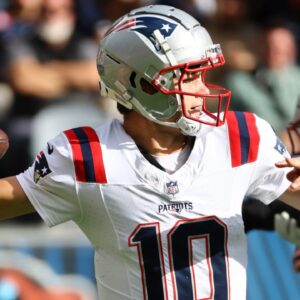 Nov 10, 2024; Chicago, Illinois, USA; New England Patriots quarterback Drake Maye (10) drops back to pass against the Chicago Bears during the first quarter at Soldier Field.