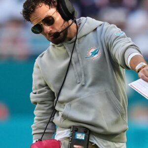 Miami Dolphins head coach Mike McDaniel walks on the field during the second half against the New England Patriots at Hard Rock Stadium.