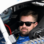 NASCAR Cup Series driver Ricky Stenhouse Jr. (47) sits in his car Sunday, July 21, 2024, ahead of the Brickyard 400 at Indianapolis Motor Speedway.