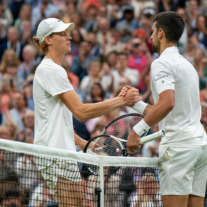 Novak Djokovic (SRB) and Jannik Sinner (ITA) at the net after their match on day 12 of Wimbledon